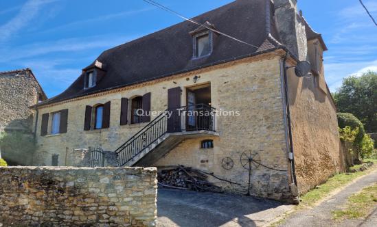 Charming old house with its small dovecote on the side, in stones, with terrace and small garden.