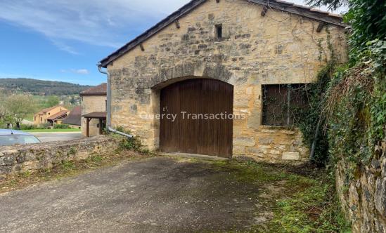 Easily accessible stone garage in the heart of a village 