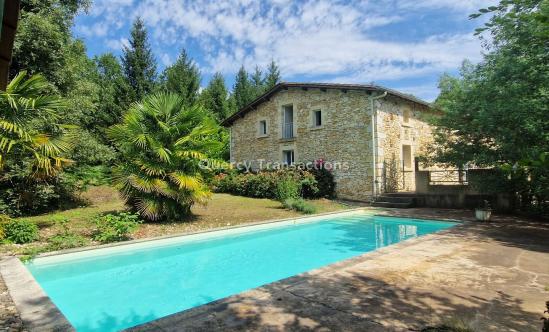 Stone property with swimming pool set in 4 hectares of parkland and woods.